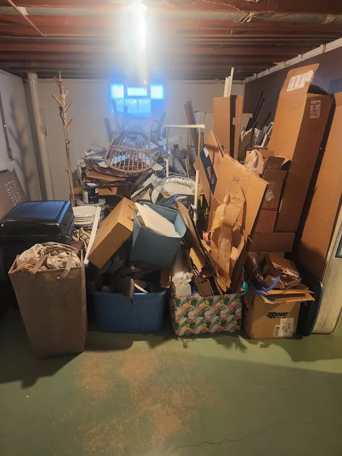 Roll-off dumpster container at job site for 2 Yard Dumpster Rental in Warrensburg